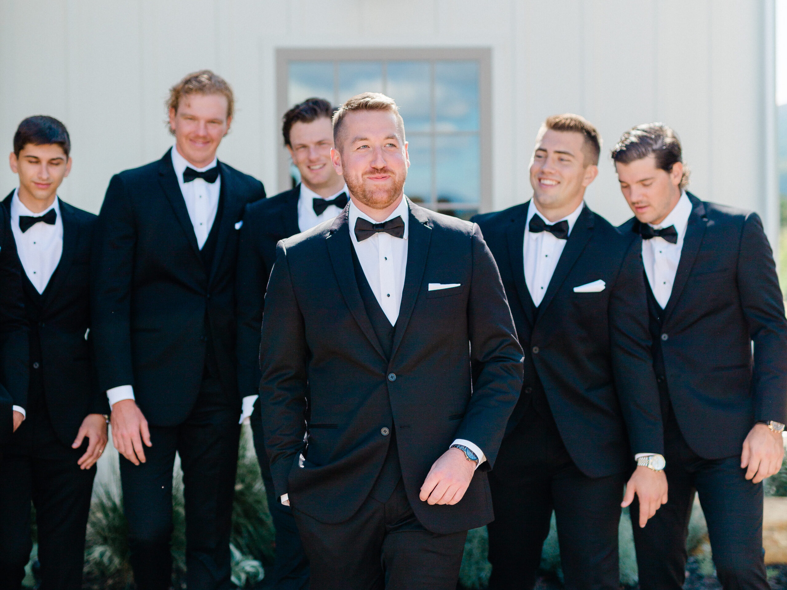 groom and five bridesmaids in formal wear
