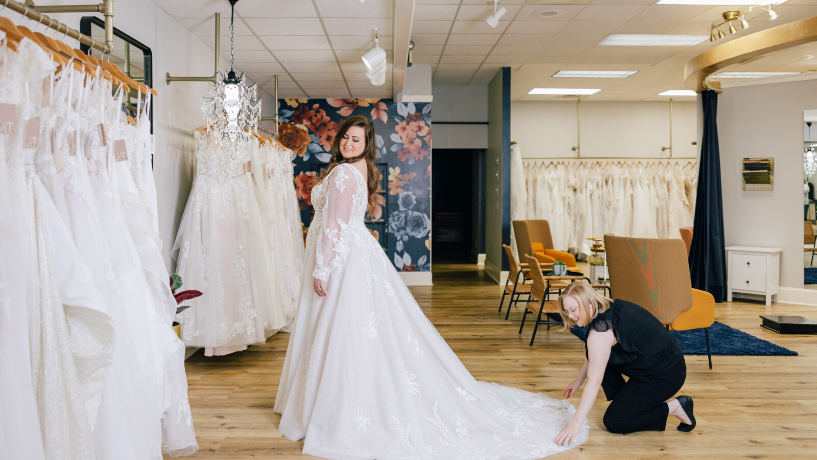 bridal stylist flattening bride's dress train