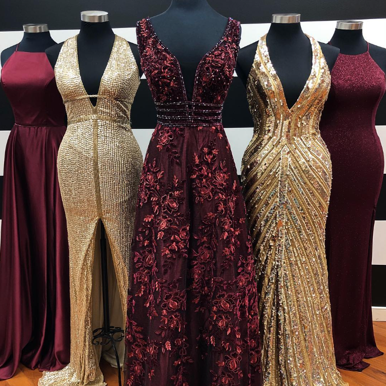 5 mannequins decorated with ornate prom and pageant gowns