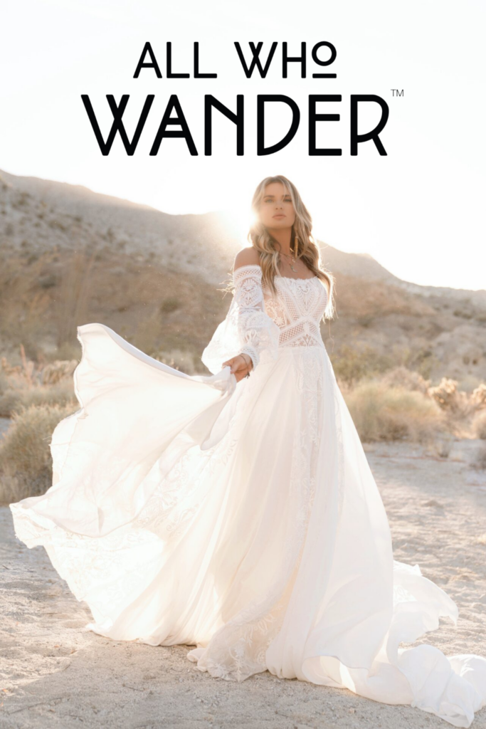 bride posing outside in a wedding gown with all who wander logo at the top