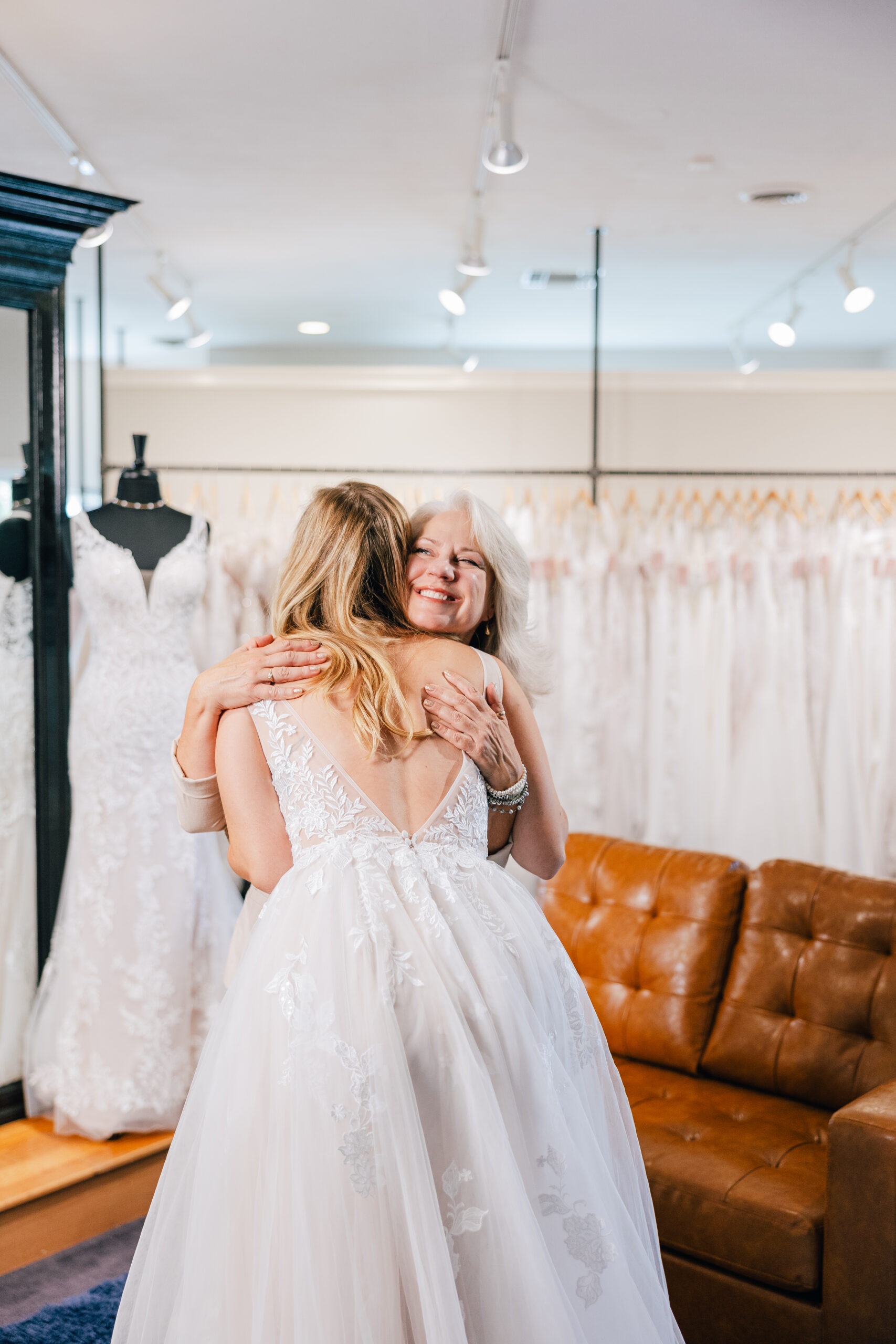 bride and her mom hugging at her bridal appointment