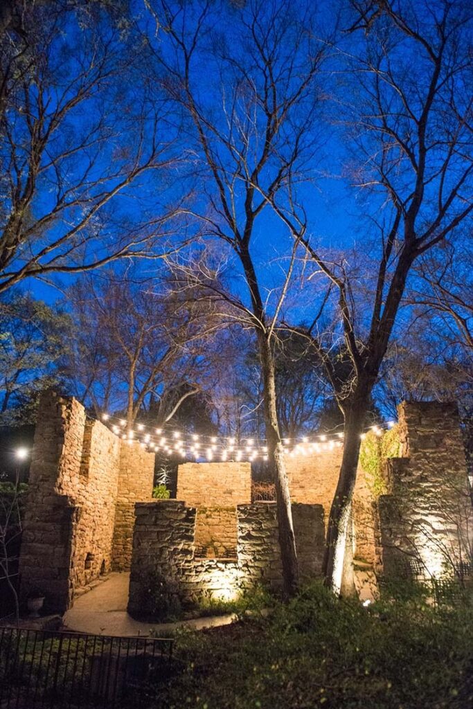 A beautiful stone structure at the Mill at Fine Creek, a Virginia wedding venue with hanging string lights.