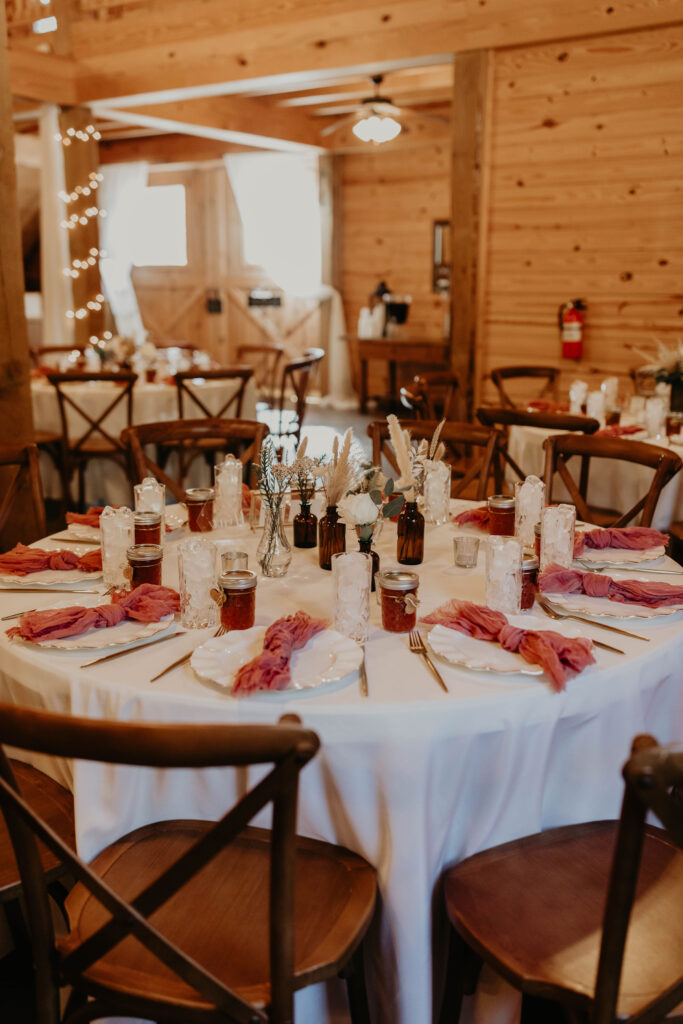 Cozy barn interior decorated for a wedding with rustic touches.